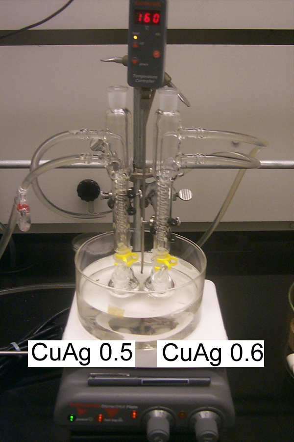 The basic setup for most nanoparticle syntheis.  A three necked round bottom flask with a reflux condensor was heated in a oil bath.  Ethylene glycol with polyvinylpyrolidone was heated and then the metal salt disolved in solvent was rapidly injected into the solution.  As the metal salt was reduced by the ethylene glycol, samples were taken and diluted in cold ethanol for electron microscopy and spectrographic analysis.  The examples metal nanoparticles synethsized are shown below.